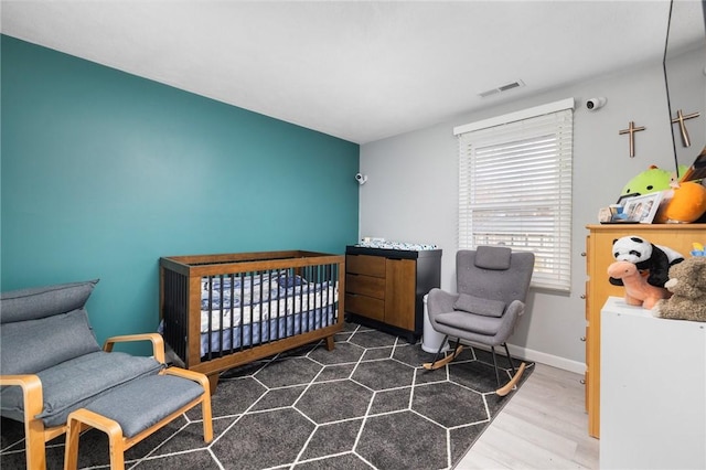 bedroom with dark hardwood / wood-style flooring