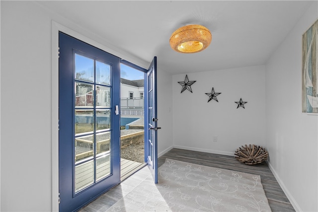 entryway with hardwood / wood-style floors