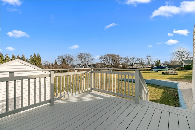 wooden deck with a lawn