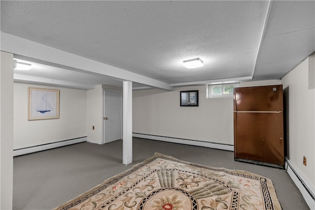 basement with a baseboard heating unit and a textured ceiling