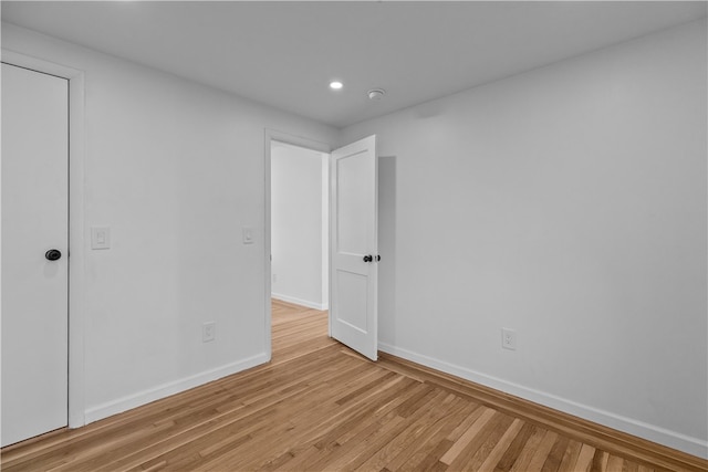 spare room featuring light hardwood / wood-style floors