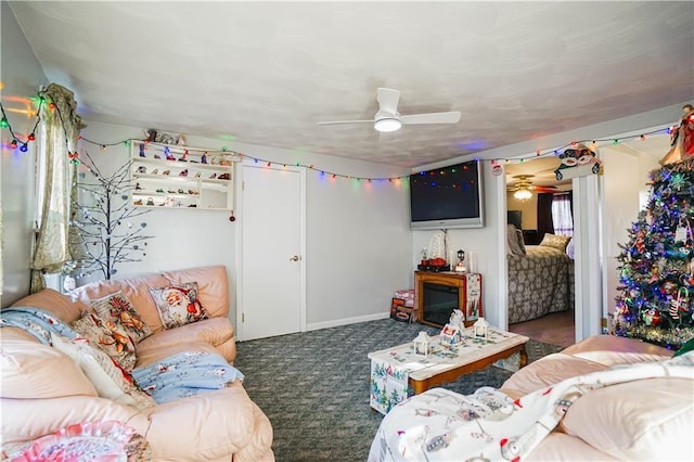 carpeted living room with ceiling fan