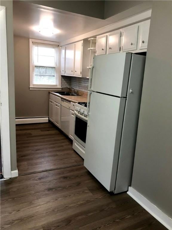 kitchen with dark hardwood / wood-style floors, white cabinets, white appliances, and baseboard heating