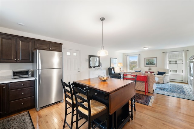 dining area with light hardwood / wood-style floors