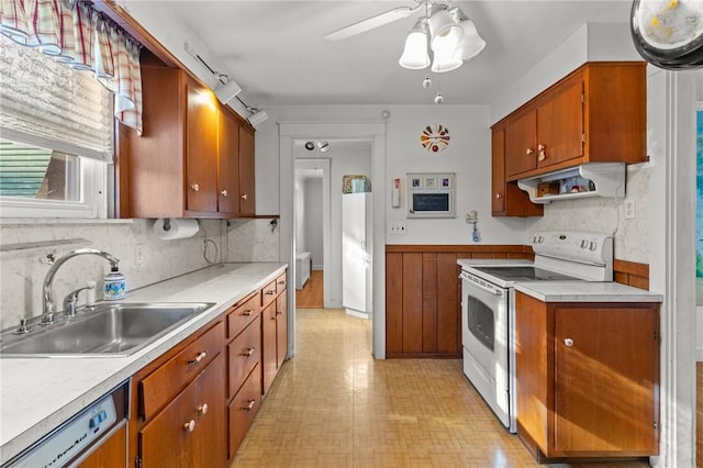 kitchen featuring sink, ceiling fan, dishwasher, range hood, and white range with electric stovetop