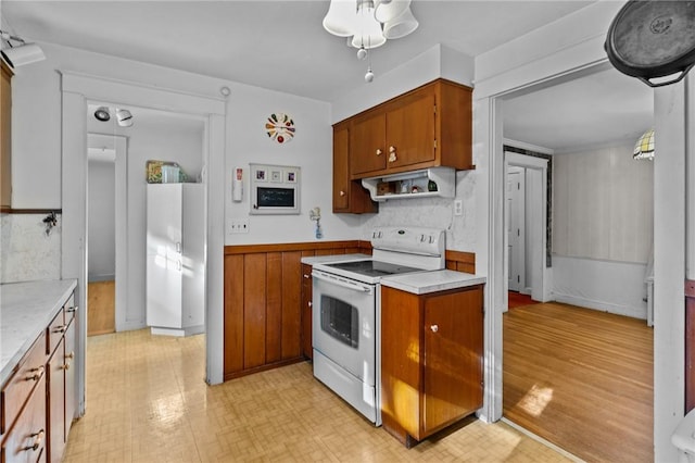 kitchen featuring range hood and electric range