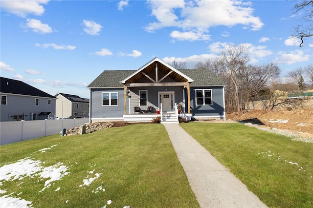 view of front facade with a front lawn and a porch