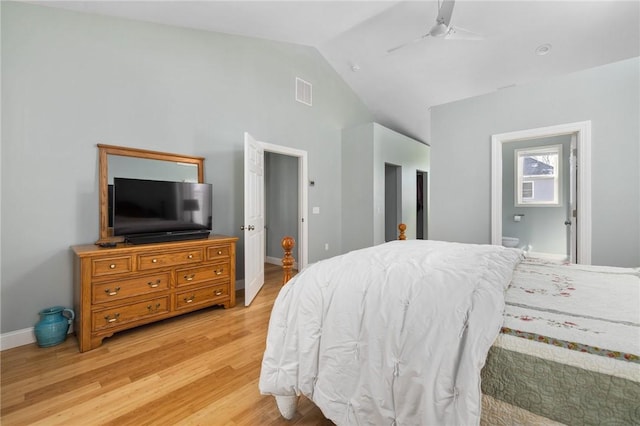 bedroom featuring visible vents, baseboards, ceiling fan, vaulted ceiling, and light wood-type flooring