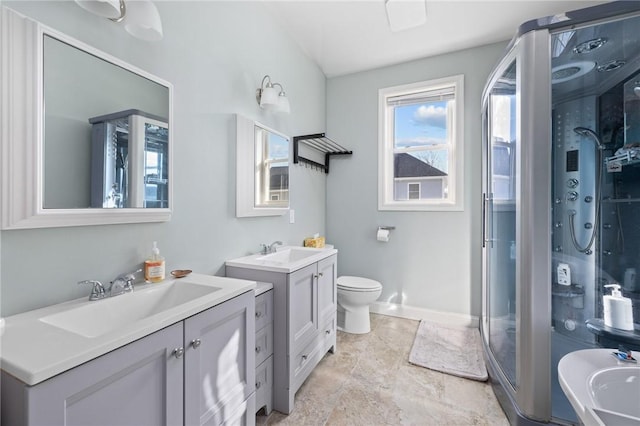 bathroom with vanity, walk in shower, and toilet