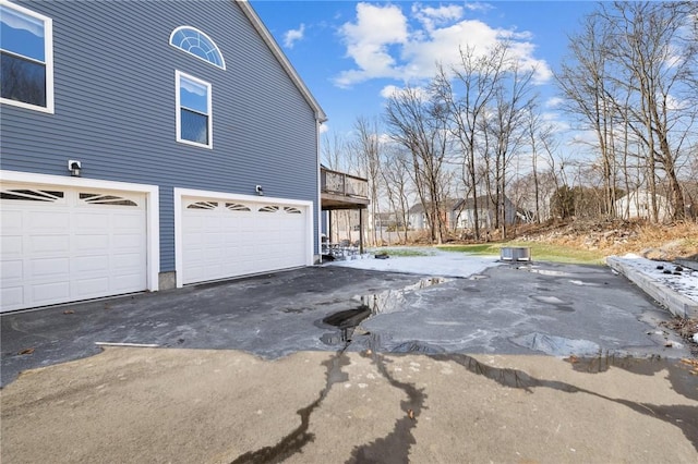 view of side of home featuring a garage