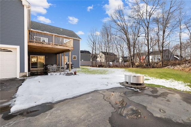 view of patio / terrace with a grill and a garage