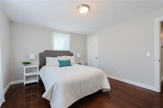 bedroom featuring dark hardwood / wood-style floors