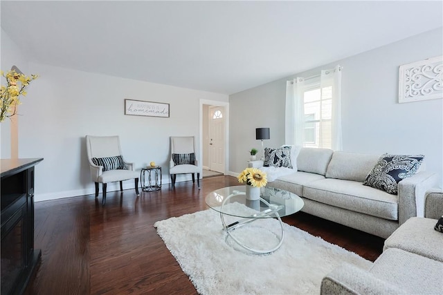 living room with dark hardwood / wood-style flooring