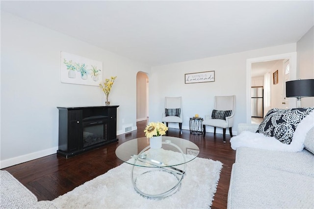 living room featuring dark hardwood / wood-style flooring