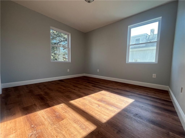 empty room with hardwood / wood-style flooring