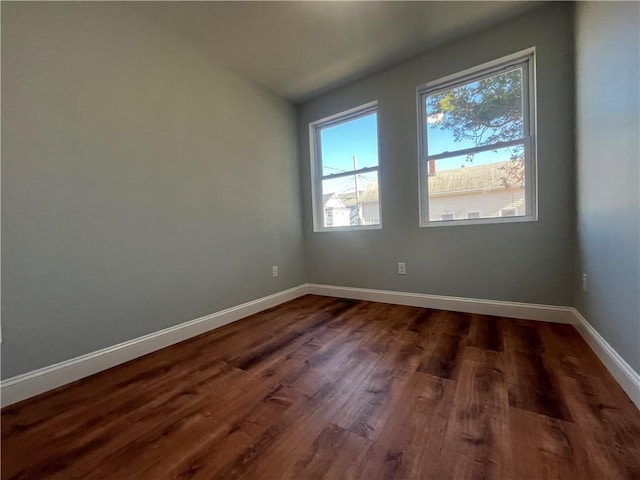 empty room featuring dark hardwood / wood-style floors