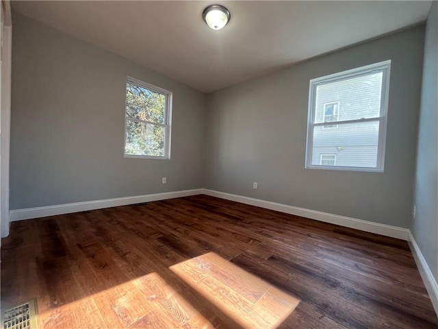 spare room featuring hardwood / wood-style flooring