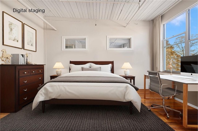 bedroom featuring hardwood / wood-style flooring and wood ceiling