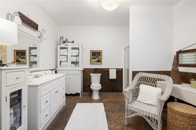 bathroom featuring vanity and toilet