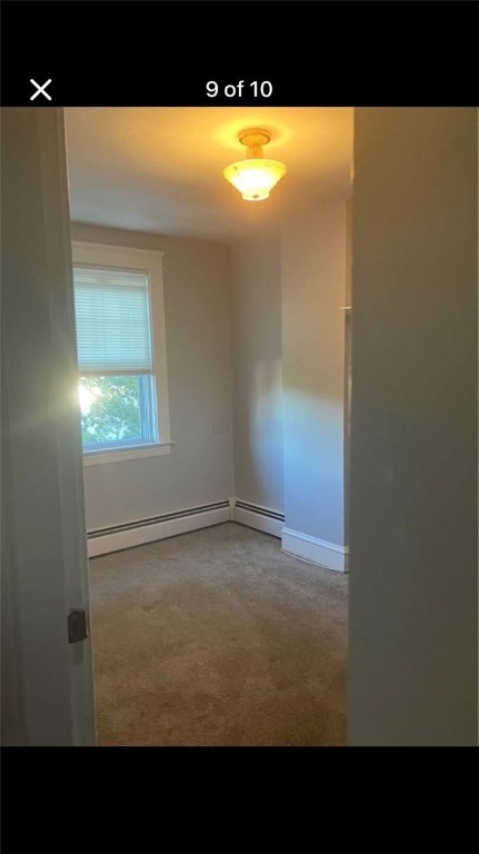 spare room with a baseboard heating unit