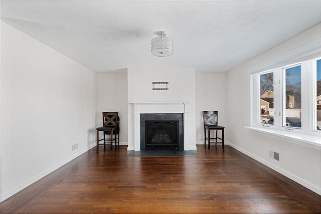 unfurnished living room with dark hardwood / wood-style floors