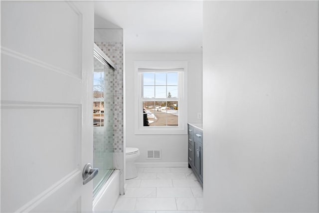 full bathroom with vanity, combined bath / shower with glass door, and toilet