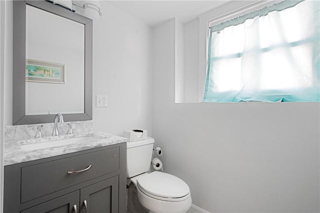 bathroom with vanity and toilet