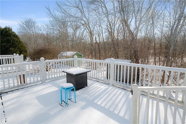 view of snow covered deck