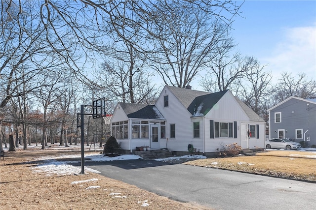 view of side of property with a sunroom