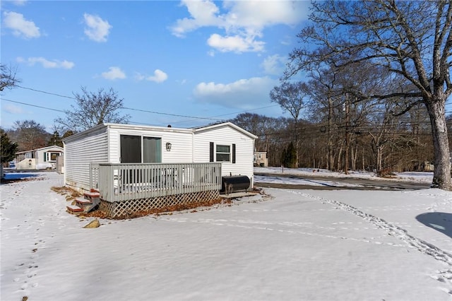 view of front of property with a wooden deck