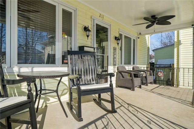 view of patio / terrace with ceiling fan and a porch