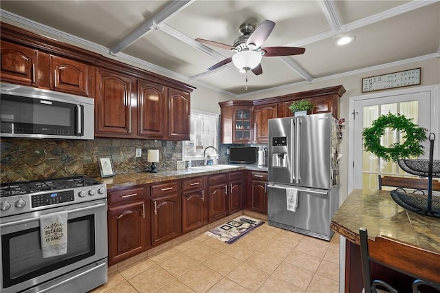 kitchen featuring ornamental molding, appliances with stainless steel finishes, sink, and decorative backsplash