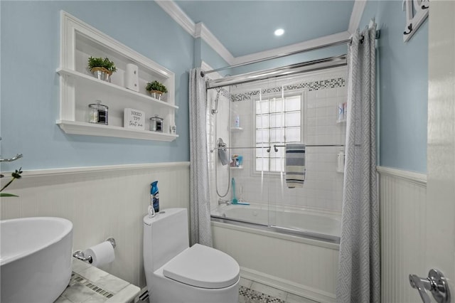 bathroom featuring enclosed tub / shower combo, crown molding, and toilet