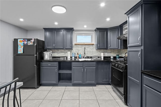 kitchen featuring light tile patterned flooring, exhaust hood, tasteful backsplash, and black appliances