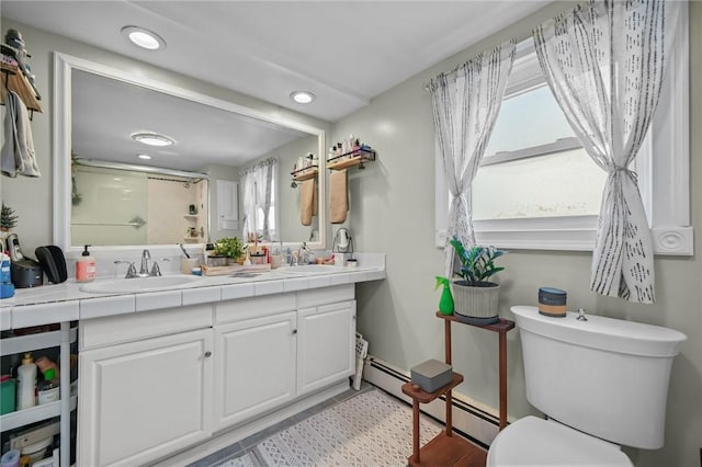 bathroom with baseboard heating, vanity, toilet, and an enclosed shower