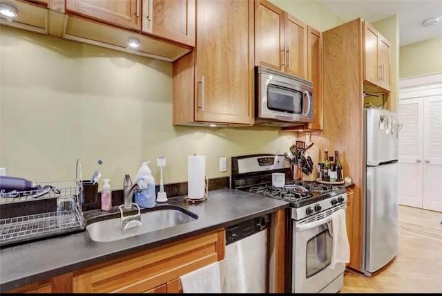 kitchen featuring appliances with stainless steel finishes and sink