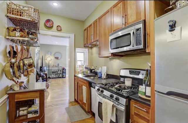 kitchen featuring stainless steel appliances and sink