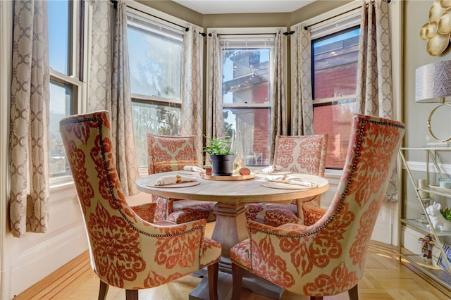 dining room featuring light parquet floors