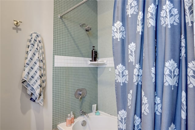 bathroom featuring shower / bathtub combination with curtain