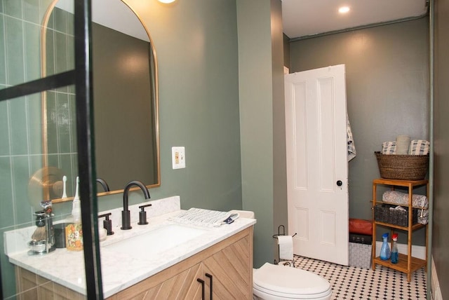 bathroom with vanity and toilet