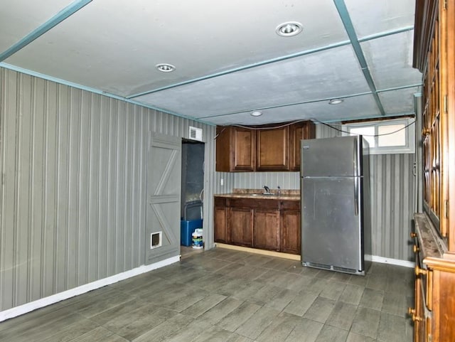 kitchen with stainless steel refrigerator and sink