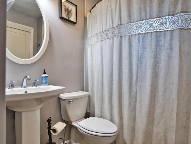 bathroom with sink and toilet