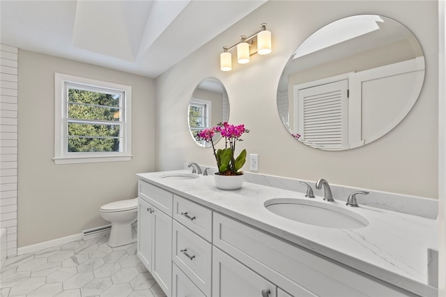 bathroom with vanity, tile patterned flooring, and toilet