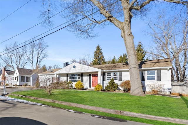 ranch-style house featuring a front yard