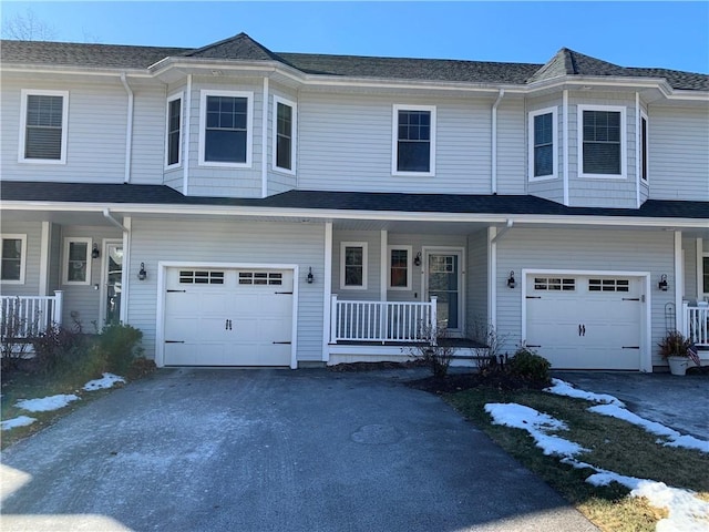 view of front of property with a garage and covered porch