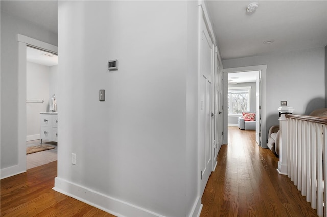 hall with wood-type flooring