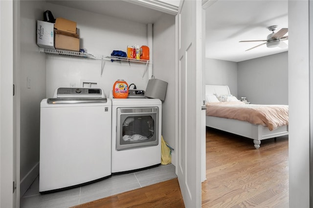 washroom featuring ceiling fan, separate washer and dryer, and light hardwood / wood-style floors