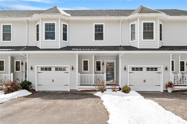 view of front of home with a garage and covered porch