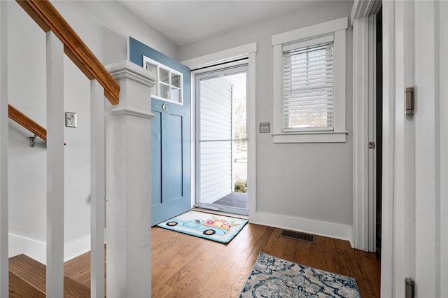 doorway to outside featuring hardwood / wood-style flooring and plenty of natural light