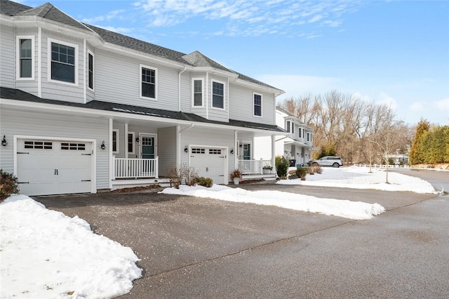 view of front of property with a garage and covered porch